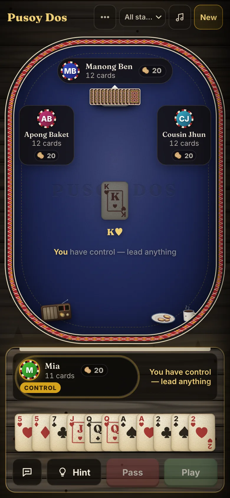 Pusoy Dos on a phone in portrait: the other players around the table, your cards along the bottom, and the Hint, Pass and Play buttons.